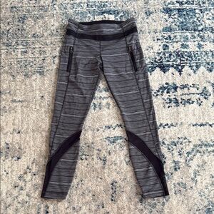 Lululemon Gray and Black Striped Leggings with Zipper Pockets and Mesh Detail
